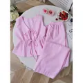 Ensemble deux pièces chic à rayures roses et blanches avec gilet noué et pantalon large - Rose
