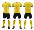 Three-angle view of yellow and black quick-dry football kit with jersey, shorts, and socks - 3XS / Top And Bottom / Gold Yellow
