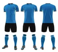 Full blue and black soccer uniform set including jersey, shorts and matching socks. - Medium Blue