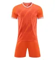 Vista frontal detallada de un conjunto de fútbol transpirable naranja para entrenamiento - Niños 3XS / Top Y Pantalón / Naranja