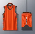 Close-up detail of the orange basketball jersey set with grey contrast side panels - Orange