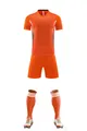 Detailed view of the vibrant orange breathable soccer jersey set with shorts and socks - 3XS / Top And Bottom / Orange