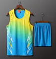 Detail view of athletic track set with yellow and blue gradient lightning pattern - Men's L / Top And Bottom / Blue