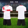 Front and back view of white and red soccer jersey set in football stadium setting - 3XS / Top And Bottom / White/Blue (T8)