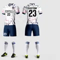 Detail of custom soccer jersey with white and sapphire blue geometric sublimation pattern - XXS / Top And Bottom / White Royal Blue