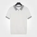 Schlank geschnittenes Herren-Strickpoloshirt mit Netzstruktur in atmungsaktivem Weiß - M / Oberteile / Weiß
