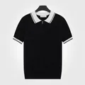 Polo en maille ajusté pour hommes, noir avec col blanc contrasté et fermeture éclair. - M / Hauts / Noir