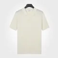 Polo en maille de soie glacée à manches courtes pour hommes en abricot avec texture côtelée - M / Hauts / Abricot
