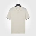 Polo en maille de soie glacée pour homme avec col en V mouette en couleur abricot - M / Hauts / Abricot