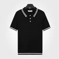 Classic black knitted polo shirt with white stripe trim details for men - M / Tops / Black