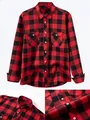 Detailed macro view of red and black buffalo plaid shirt with buttons and fabric texture - S / Tops / Red