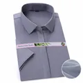 Detail of light gray bamboo fiber short-sleeved business shirt showing fabric texture - 38 / Tops / Gray Fine Stripe