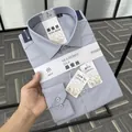Detailed shot of a folded men's mulberry silk and modal blend formal shirt with tags - 38 / Tops / Gray