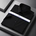 Men's black non-iron short sleeve dress shirt with a clean, pocketless design - Midnight Black