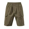 Detailed frontal view of olive green cargo shorts with elastic waist and side pockets - S / Bottoms / Army Green
