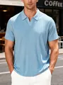 Close-up of light blue men's textured polo shirt in an outdoor street setting - Light Blue