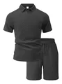Close-up of men's dark grey polo shirt and shorts set with diamond textured jacquard fabric - S / Top And Bottom / Black