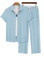 Detail view of men's light blue vertical striped short-sleeve shirt and matching pants set - Light Blue