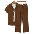 Detailed view of men's brown vertical pleated short sleeve shirt and pants two-piece set - Coffee