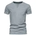 Detail view of a men's gray Henley T-shirt with a chest pocket and soft breathable fabric - S / Tops / Gray