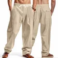 Detail of men's loose breathable wide-leg trousers in beige with drawstring waist. - S / Bottoms / Apricot