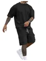 Detail view of men's black oversized T-shirt and matching cargo shorts outfit set. - S / Top And Bottom / Black