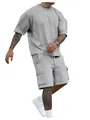 Detail view of men's gray oversized T-shirt and cargo shorts two-piece athletic set - S / Light Gray