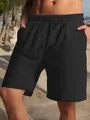 Detailed view of black men's summer casual shorts featuring breathable jacquard fabric - S / Bottoms / Black