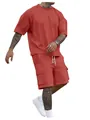 Close-up of men's summer two-piece set in terracotta red with oversized tee and cargo shorts. - S / Brick Red