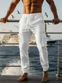 Breathable white linen cargo pants for men featuring a drawstring waist and side pockets - S / Bottoms / White