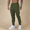 Men's slim-fit athletic joggers in olive green with drawstring and elastic waist. - Army Green