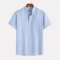 Detalle de camisa de manga corta retro con rayas verticales azules y blancas - S / Tops / Azul
