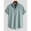 Detailed view of men's striped short sleeve shirt with cuffed sleeves and Henley neck - Green