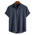 Detailed view of navy blue striped men's shirt featuring Henley collar and short sleeves - Navy Blue