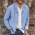 Close-up of a men's light blue linen blazer showing the fabric texture and button detail - S / Tops / Blue