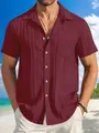 Detail view of men's burgundy short-sleeve pleated breathable button-down casual shirt. - Burgundy