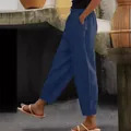 Side view detail of navy blue linen cotton trousers with elastic waist and pockets. - S / Bottoms / Dark Blue