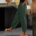 Close-up of dark green cotton linen casual pants with elastic waist and side pockets. - S / Bottoms / Army Green