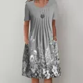Detail view of women's gray short sleeve midi dress with floral print and side pockets - S / Top And Bottom / Grey Butterfly Floral