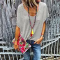 Close-up detail of women's casual grey V-neck short sleeve T-shirt in boho style. - S / Tops / Gray