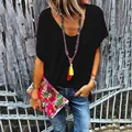 Lifestyle detail of a casual women's black V-neck short-sleeved T-shirt in summer - S / Tops / Black