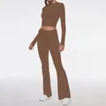 Detailed macro view showing the fabric texture and fit of the brown long sleeve top and pants - XS / Top And Bottom / Brown