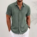 Macro detail of men's linen short sleeve shirt in sage green with button-down collar - S / Tops / Green