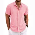 Detailed view of a premium coral pink short-sleeved linen cotton shirt for men on a model - S / Tops / Red