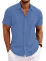 Close-up detail of blue men's linen short-sleeved shirt with textured fabric and button collar - S / Tops / Denim Blue
