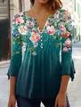 Close-up of floral print V-neck top with pleated texture and decorative buttons - Peacock Green Pink Floral