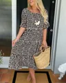 Detailed view of summer tiered dress with polka dot print and short ruffled sleeves - S / Top And Bottom / Black