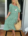 Beautiful green polka dot midi dress with ruffle sleeves styled with a straw tote bag - S / Top And Bottom / Green