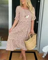 Elegant summer fashion look featuring a brown tiered midi dress with white patterns - Brown