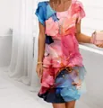 Close-up of a chiffon dress featuring a vibrant 3D floral print in pink and blue - S / Bottoms / Blue Ink Print